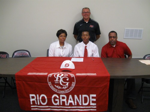 Tyler Donaldson (center) with his mother Tyna (left) and father Mark (right) along with Head Coach Brad Warnimont(back)